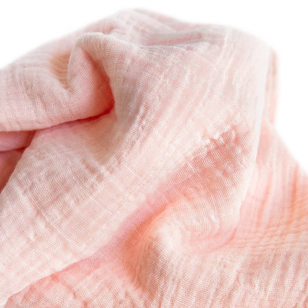 Little Unicorn Cotton Muslin Swaddle in Rose Petal, soft, breathable, ideal for swaddling, nursing, and cozy cuddles.