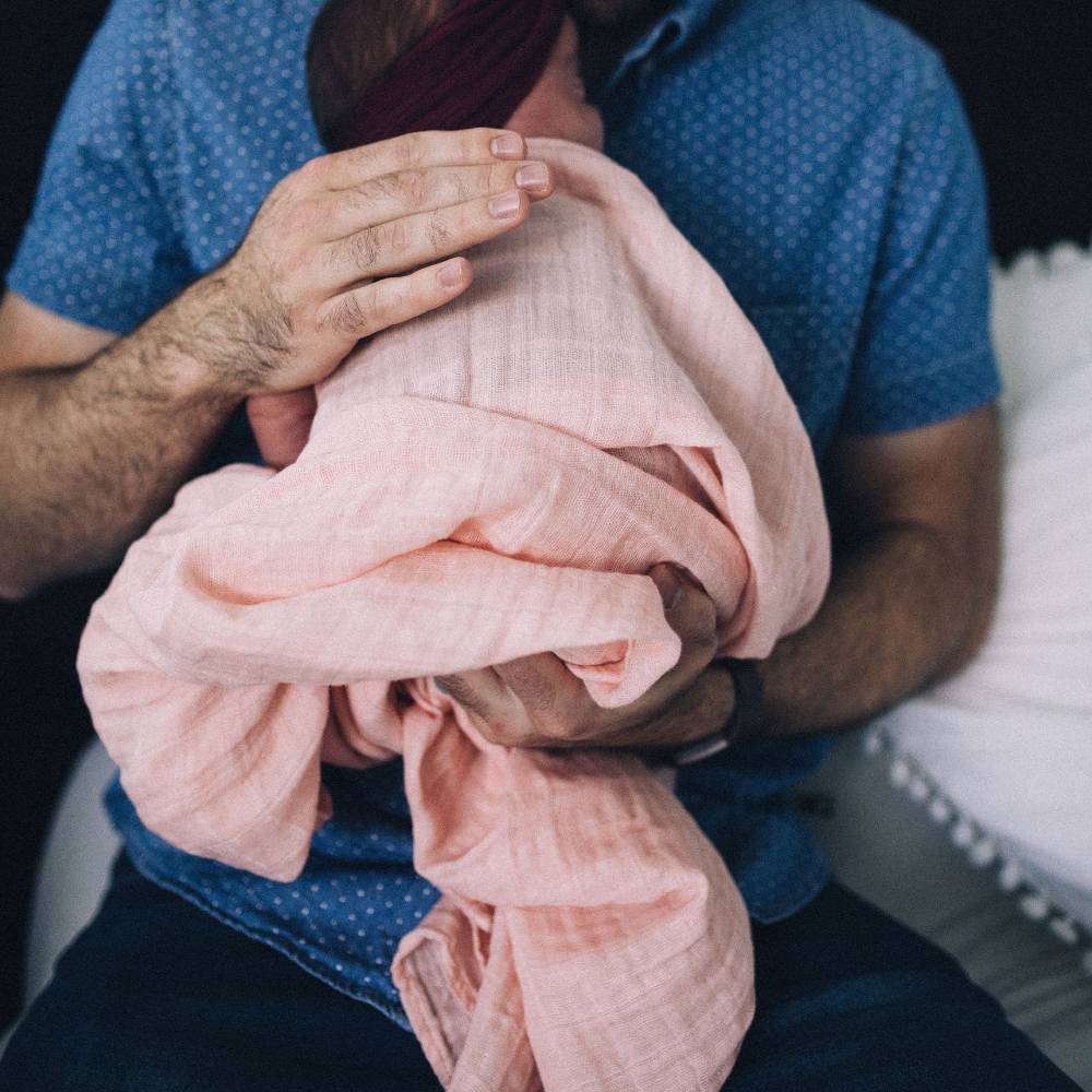 Soft cotton muslin swaddle in Rose Petal, perfect for swaddling, nursing, and ensuring cozy sleep for infants.