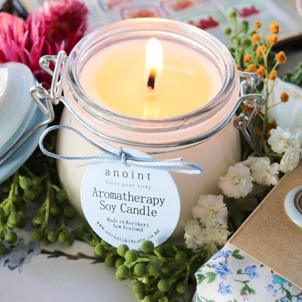 A calming soy candle infused with essential oils, rose petals, and crystals for a serene ambiance and over 25 hours of burn time.