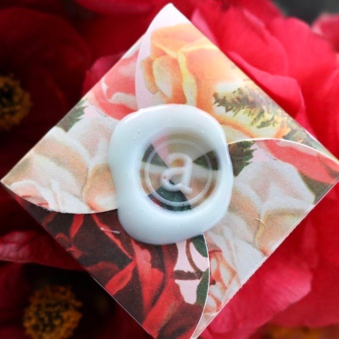 Nourishing Anoint Beeswax Lip Balm in a charming tin, perfect for soft, hydrated lips in an elegant gift box.