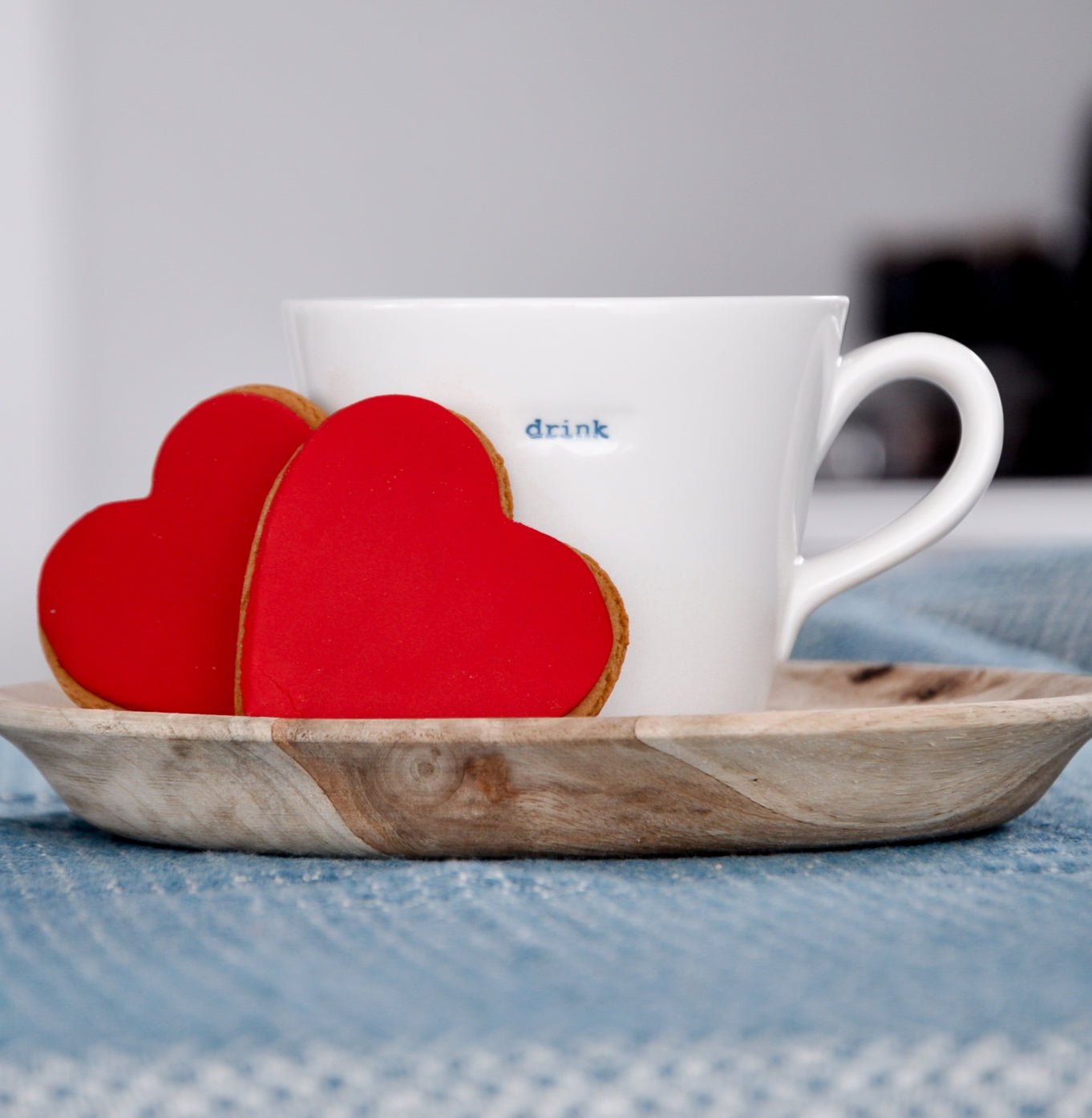 Heart-shaped ginger cookies with red icing in a twin pack, perfect for gifting or celebrating special occasions.