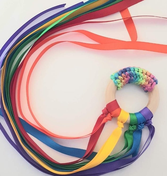 Vibrant Rainbow Ribbon Teether with soft, colorful ribbons for sensory play, handcrafted in New Zealand and non-toxic for safety.