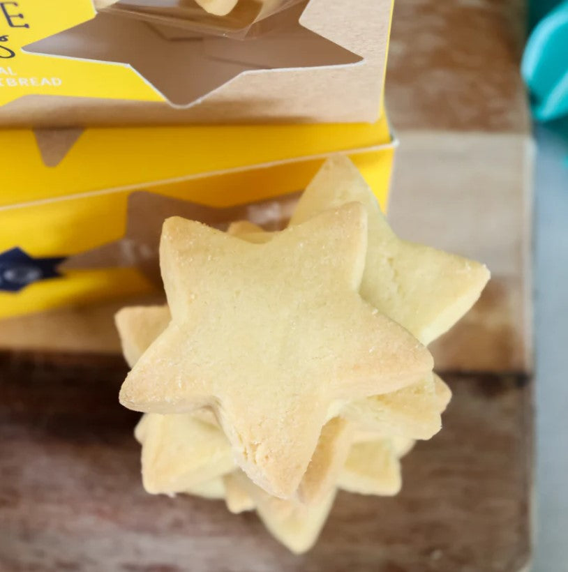 Festive star-shaped shortbread cookies, buttery and crumbly, perfect for joyous celebrations and gifting during the holidays.