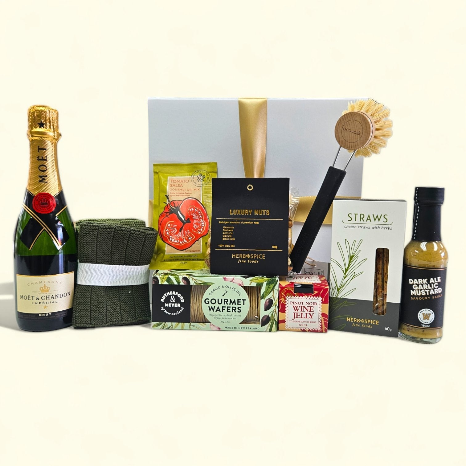 Elegant gift box containing Moet champagne, gourmet treats, eco-friendly items, and a personalized touch for new homeowners.