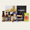 Gourmet BBQ gift box with grilling tools, sauces, and seasonings for the ultimate outdoor cooking experience.