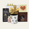 Coffee Connoisseur gift box featuring gourmet coffee, unique mug, chocolates, and treats, elegantly packaged for coffee lovers.