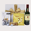 Elegant gift box featuring Jameson Whiskey, whisky rocks, honey roasted peanuts, chocolate, and a ribbon. Perfect for any occasion.