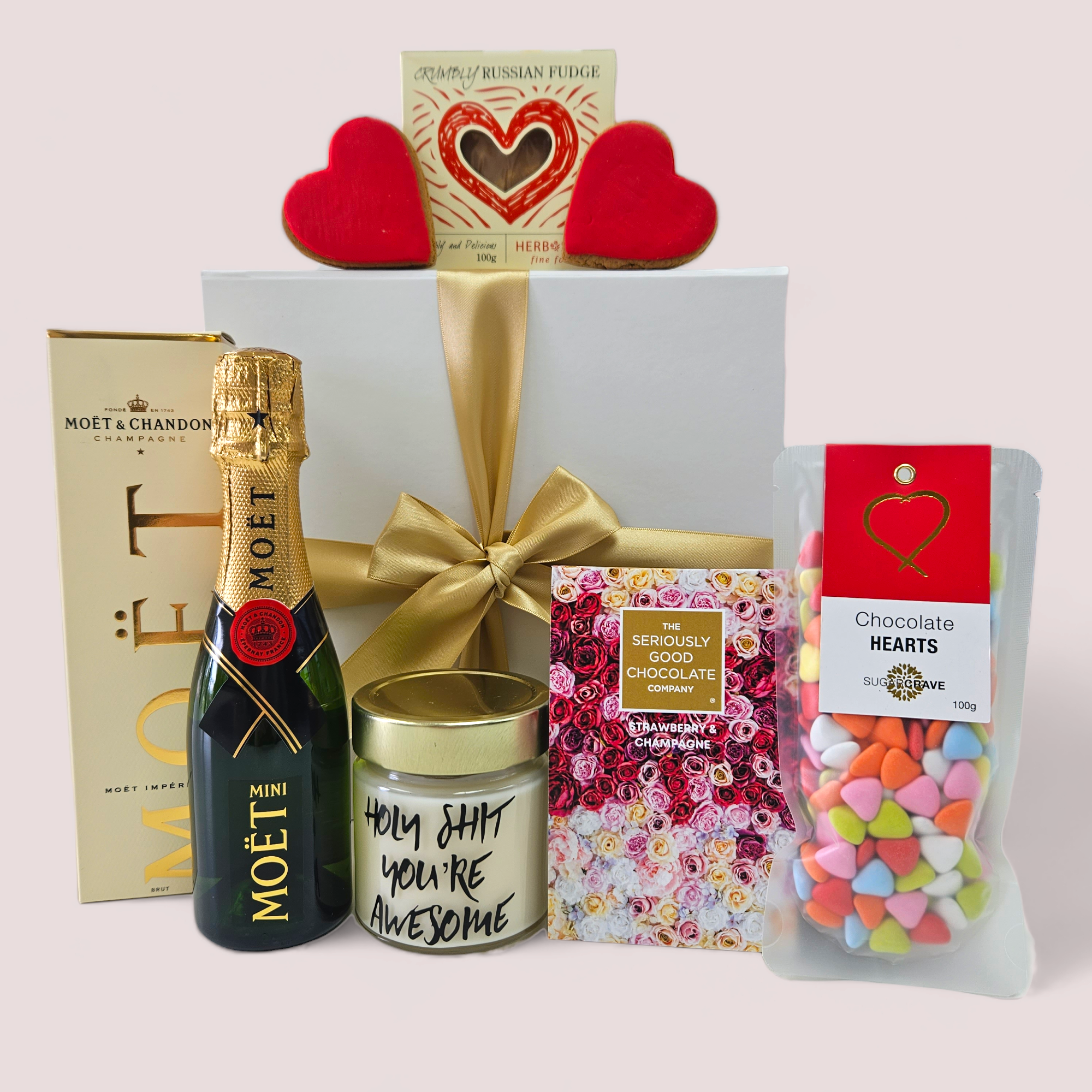 Exquisite Moet & More gift set with champagne, chocolates, fudge, and a scented candle in a beautiful box. Perfect for celebrations.