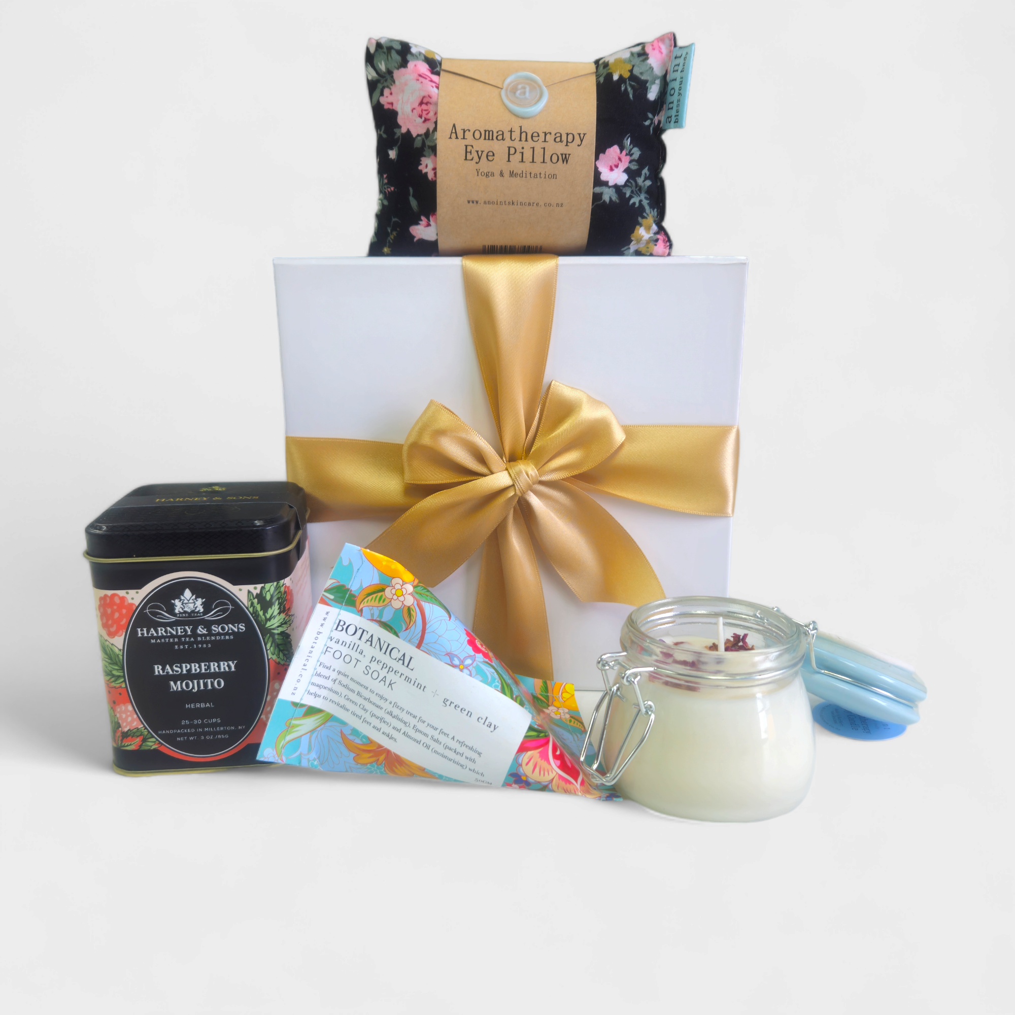 Luxurious Tranquility gift box featuring foot soak, tea, eye pillow, candle, and elegant packaging for ultimate relaxation.