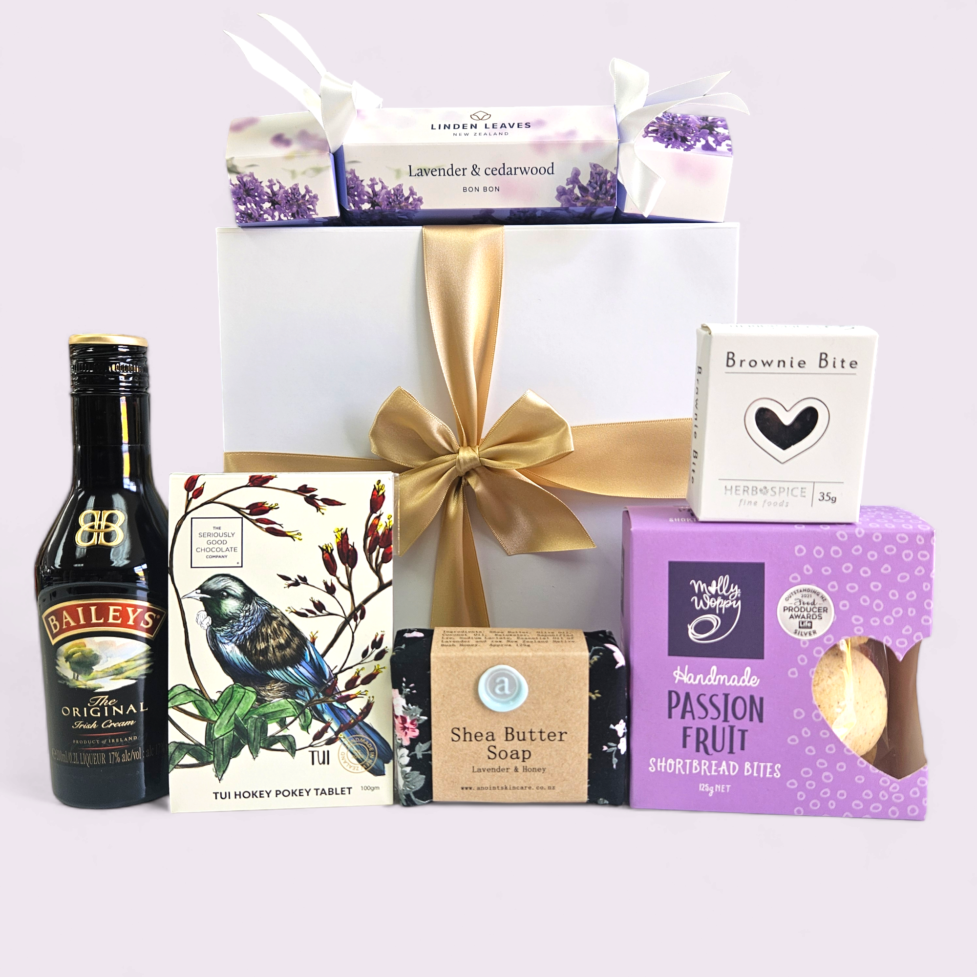 "Elegant purple gift box filled with luxurious treats, perfect for celebrating special occasions for her."