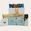 Heartfelt gift box featuring chocolate, fudge, and treats to express gratitude, beautifully presented with a ribbon.