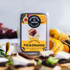 Gourmet fig and orange paste, perfect for cheese platters and desserts, enhancing culinary experiences with citrus and sweetness.