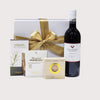 Elegant gift box featuring New Zealand Merlot and gourmet nibbles for an indulgent tasting experience.