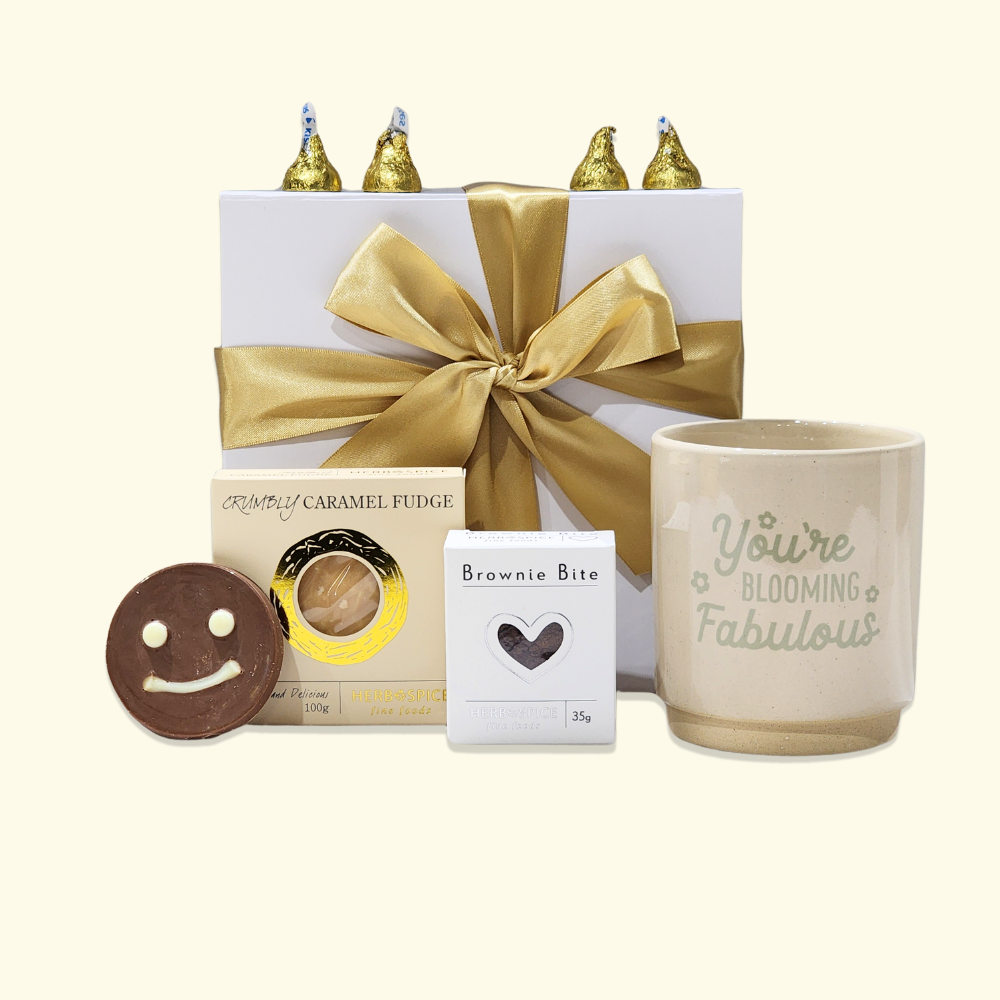 Exquisite gift box featuring a planter pot and delicious treats, beautifully packaged with a ribbon for any special occasion.