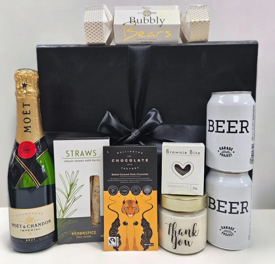 Elegant gift box with champagne, craft beer, gourmet chocolate, and more, perfect for expressing gratitude.