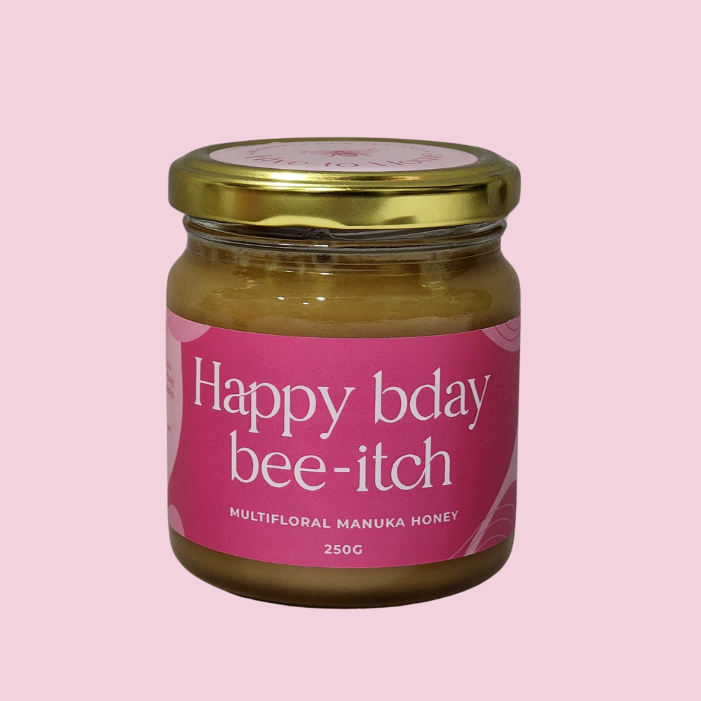 NZ Manuka Honey 250g with playful "Happy Birthday Bee-itch" label, rich flavor, perfect gift for honey lovers.