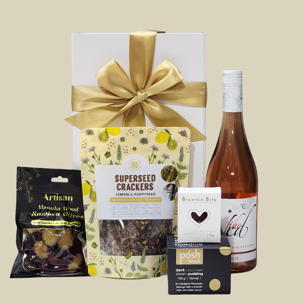 Elegant gift box featuring wine, gourmet snacks, and indulgent desserts for special occasions. Perfect for any celebration.