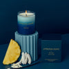 Lyttelton Lights Mo'orea Candle in a glass holder, showcasing natural soy wax and a blend of coconut and floral scents.