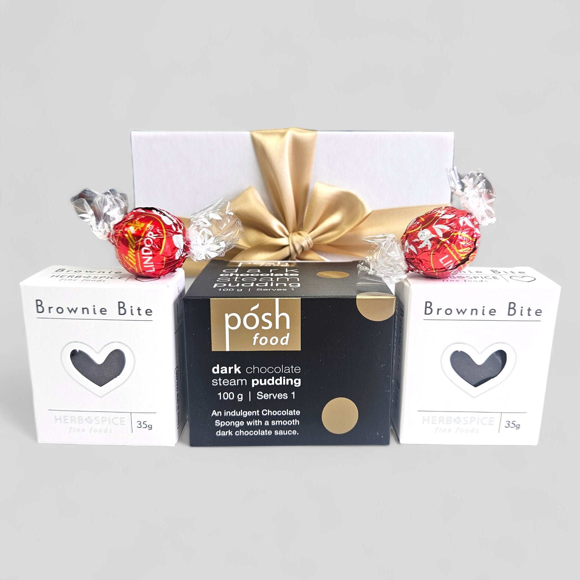 Choccy Dessert gift box featuring dark chocolate pudding, brownie bites, and Lindor chocolates, delivered free in NZ.