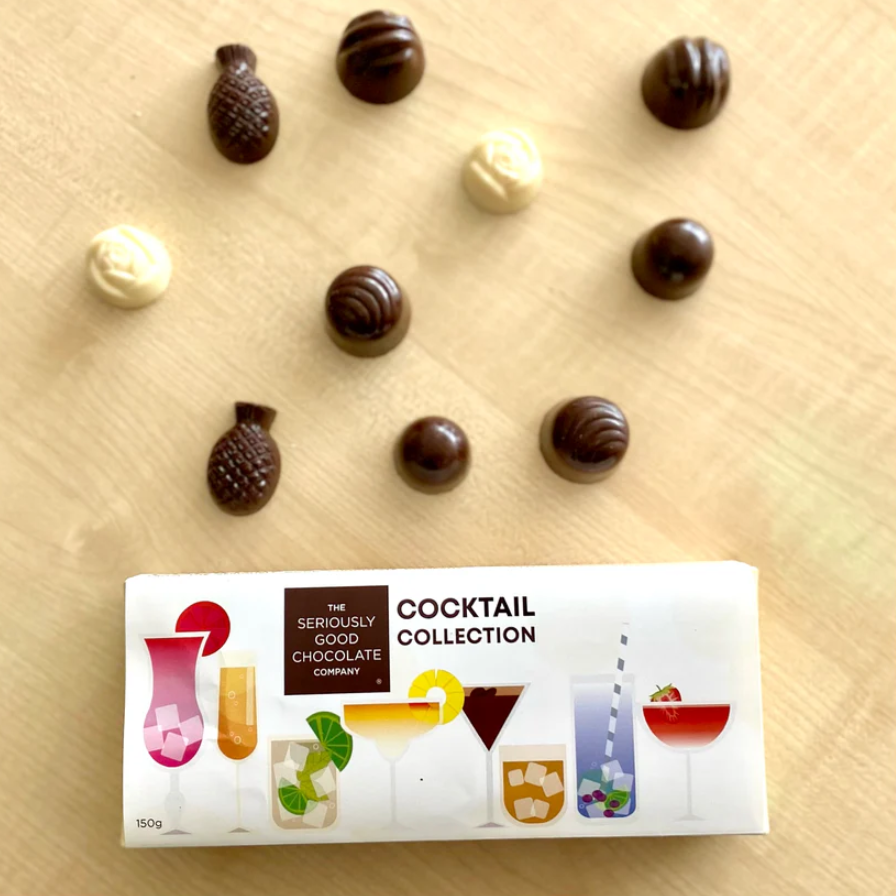 Luxurious chocolate box featuring classic cocktail flavors, perfect for sharing or gifting gourmet delights.