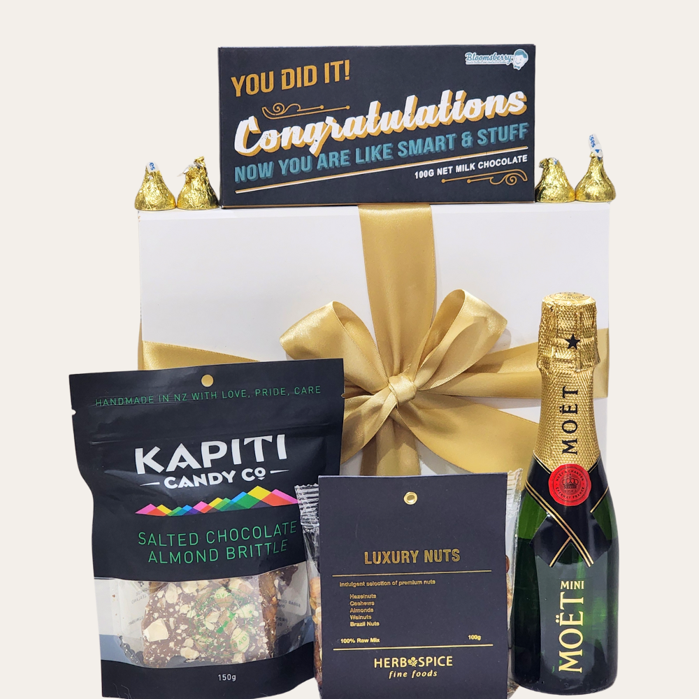 Luxurious gift box with Moët champagne, gourmet treats, and chocolates to celebrate achievements and special milestones.