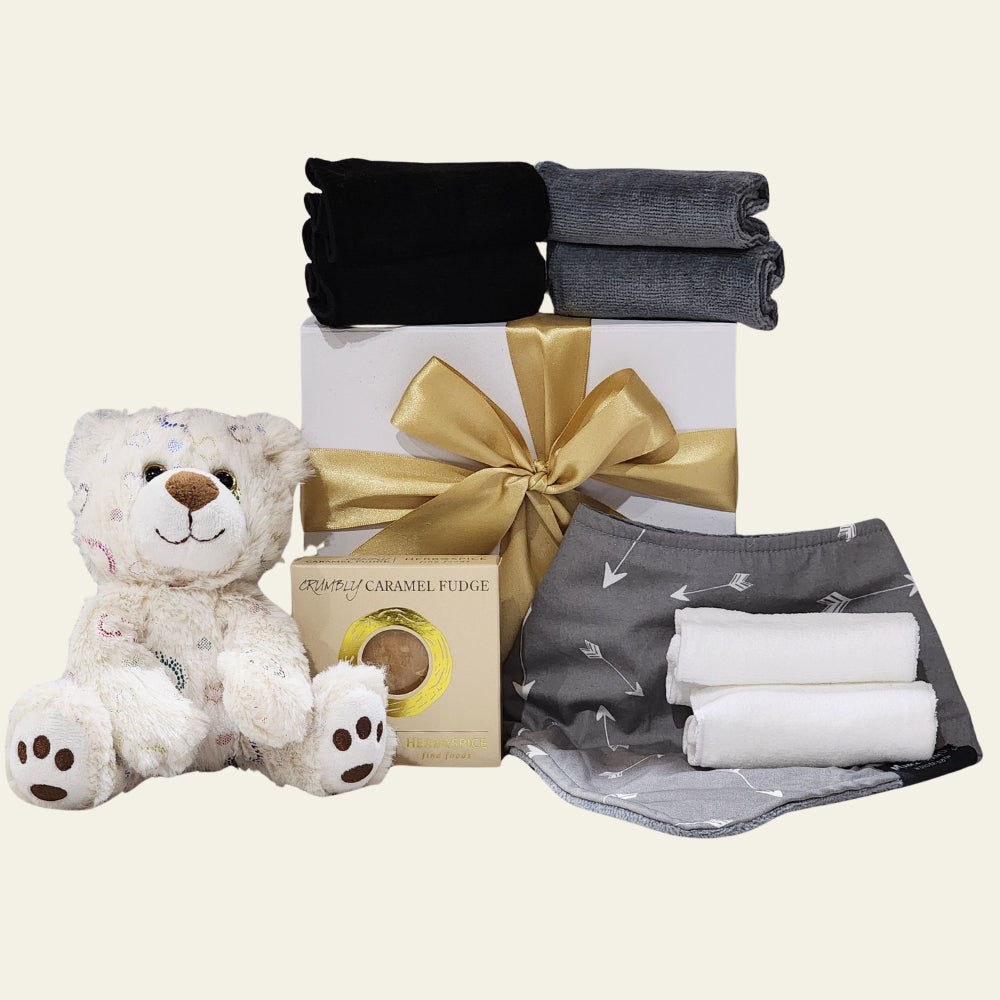 "Elegant 'Congratulations Baby' gift box with practical baby items and treats for new parents, beautifully presented."