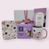 Elegant gift box filled with curated treasures for her, including a peony mug, crafting tin, luxury tea, and shortbread bites.