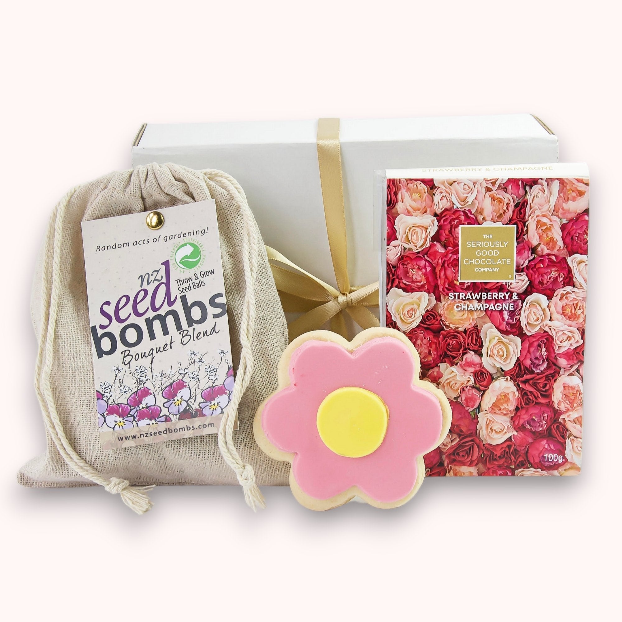 Flower Power gift box featuring seed bombs, luxurious chocolate, and whimsical shortbread, delivered free in NZ.