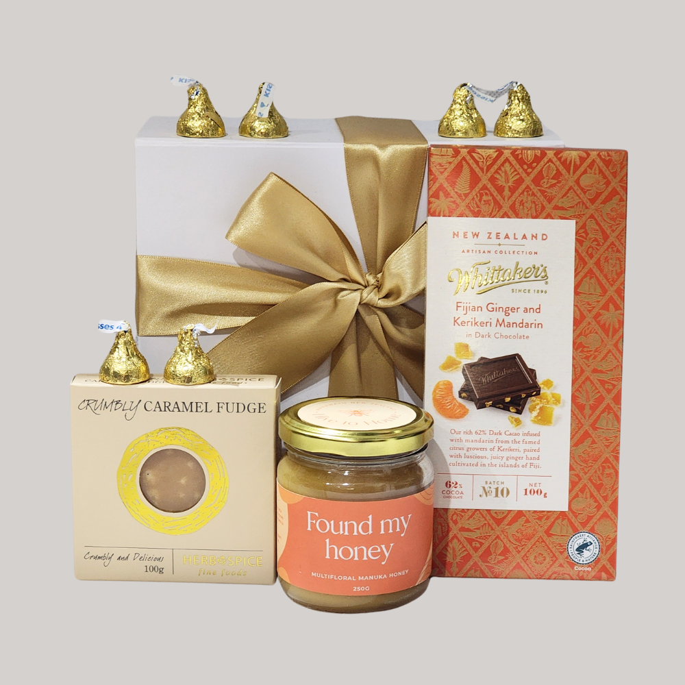 "Gift box featuring NZ Manuka honey, artisanal chocolates, and caramel fudge, ideal for romantic celebrations."