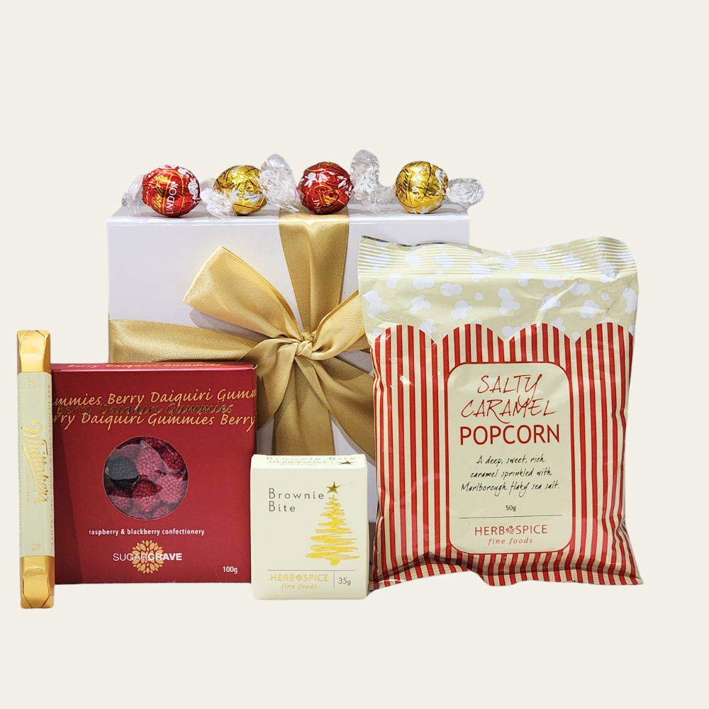 Festive Christmas Cheer Gift Box filled with chocolates, popcorn, brownies, and gummies, perfect for joyful holiday gifting.