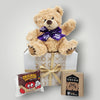 Get Well Soon gift box featuring a teddy bear, hot chocolate, cookie, and free NZ delivery to uplift spirits.