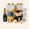 Graduation Congratulations Gift Box featuring a teddy bear, chocolates, champagne, and gourmet treats in a luxury presentation.