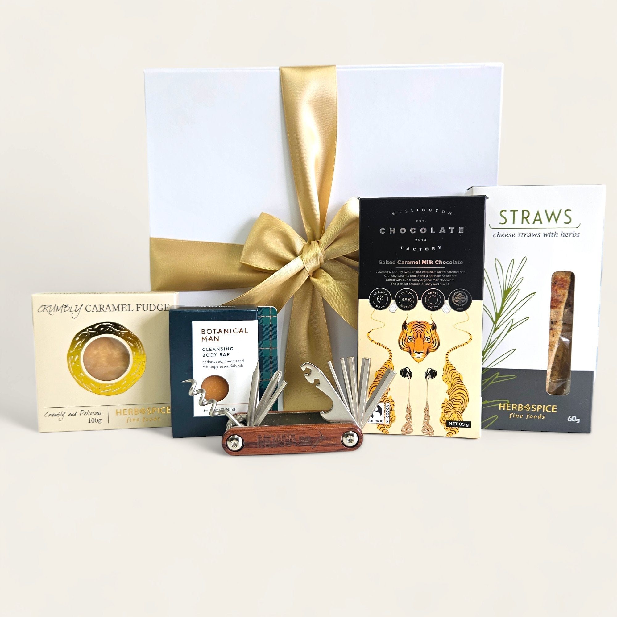 Gift box for men featuring snacks and tools, including a 6 in 1 tool, gourmet treats, and a magnetic closure design.