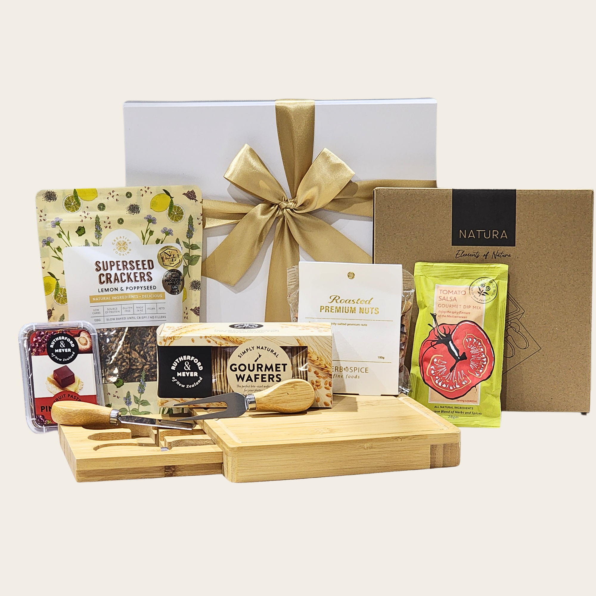 Elegant gift box featuring gourmet cheese board, tools, snacks, and a delightful assortment of spreads and crackers.