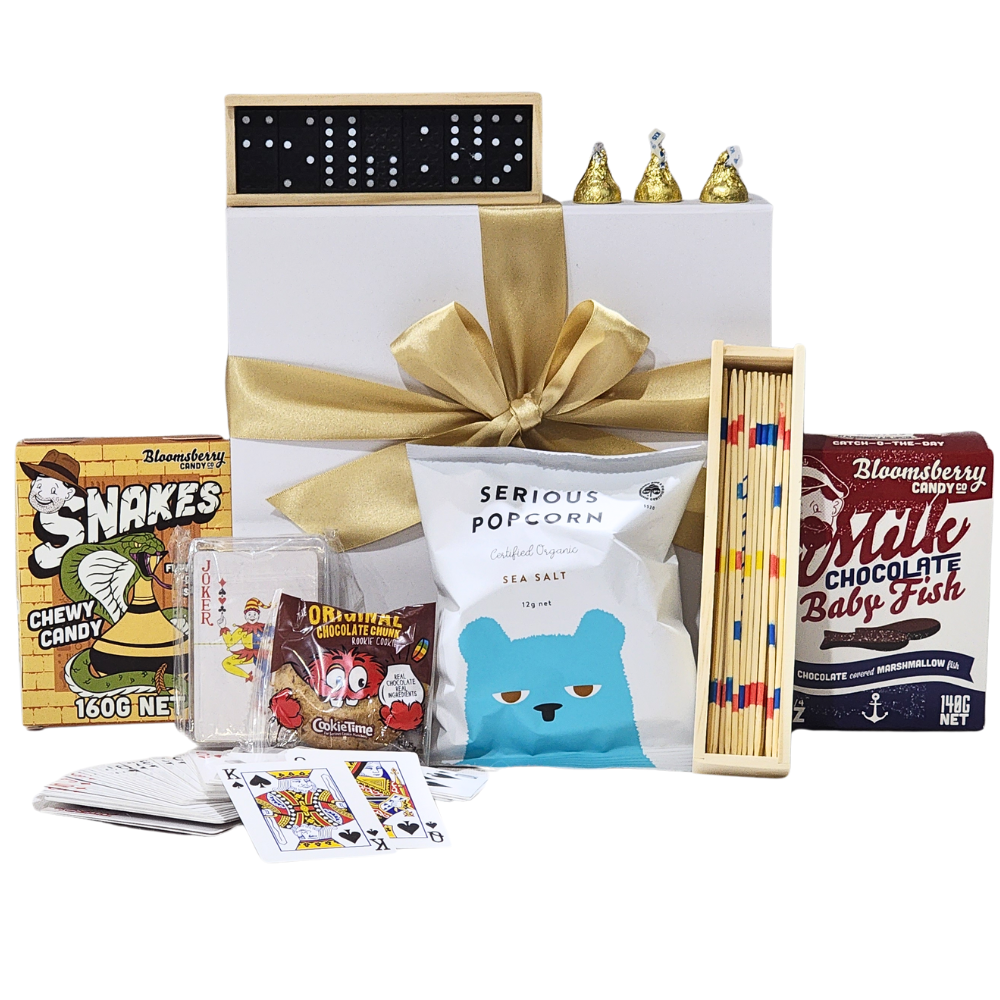 Holiday Fun Gift Box featuring treats and games, perfect for entertaining kids year-round in elegant packaging with ribbon.