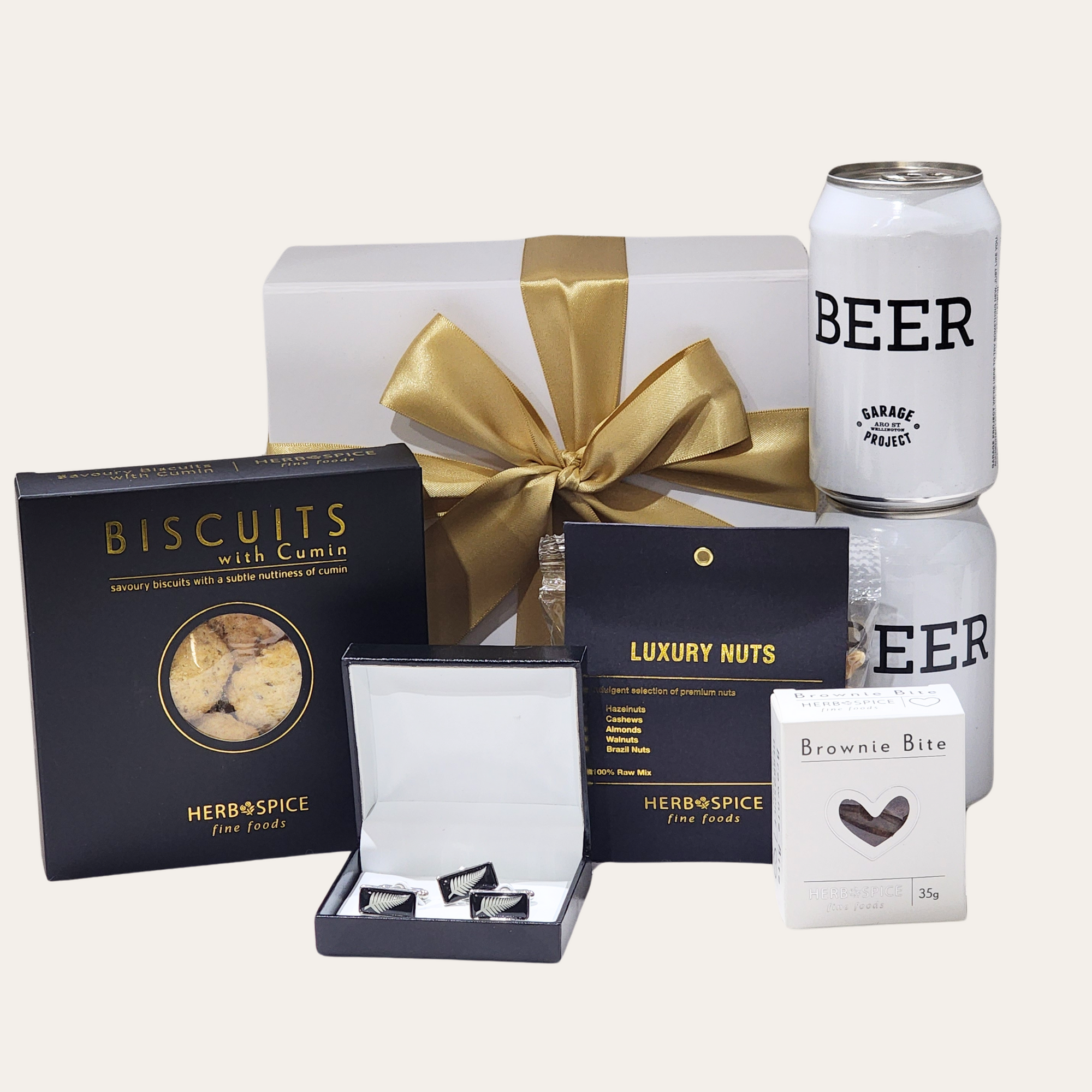 Kiwi Fern & Brews Box featuring cufflinks, beer, savory biscuits, brownie bite, nuts, and a magnetic closure gift box.