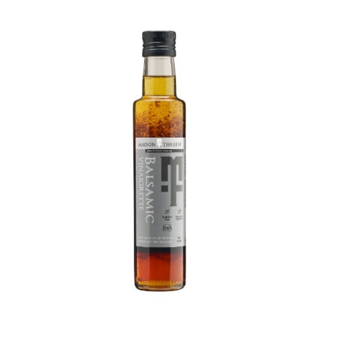 Bottle of Maison Therese Balsamic Vinaigrette, a vegan and gluten-free dressing for salads and roasted veggies.