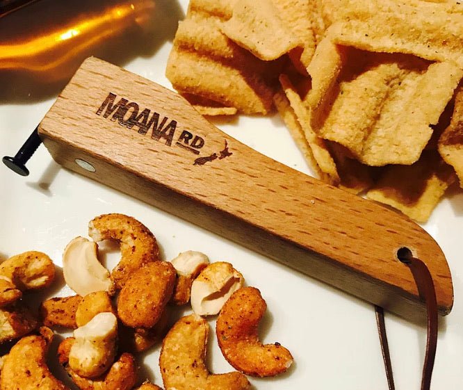 Moana Road Bottle Opener crafted from New Zealand wood, with magnets for cap catching and fridge attachment.