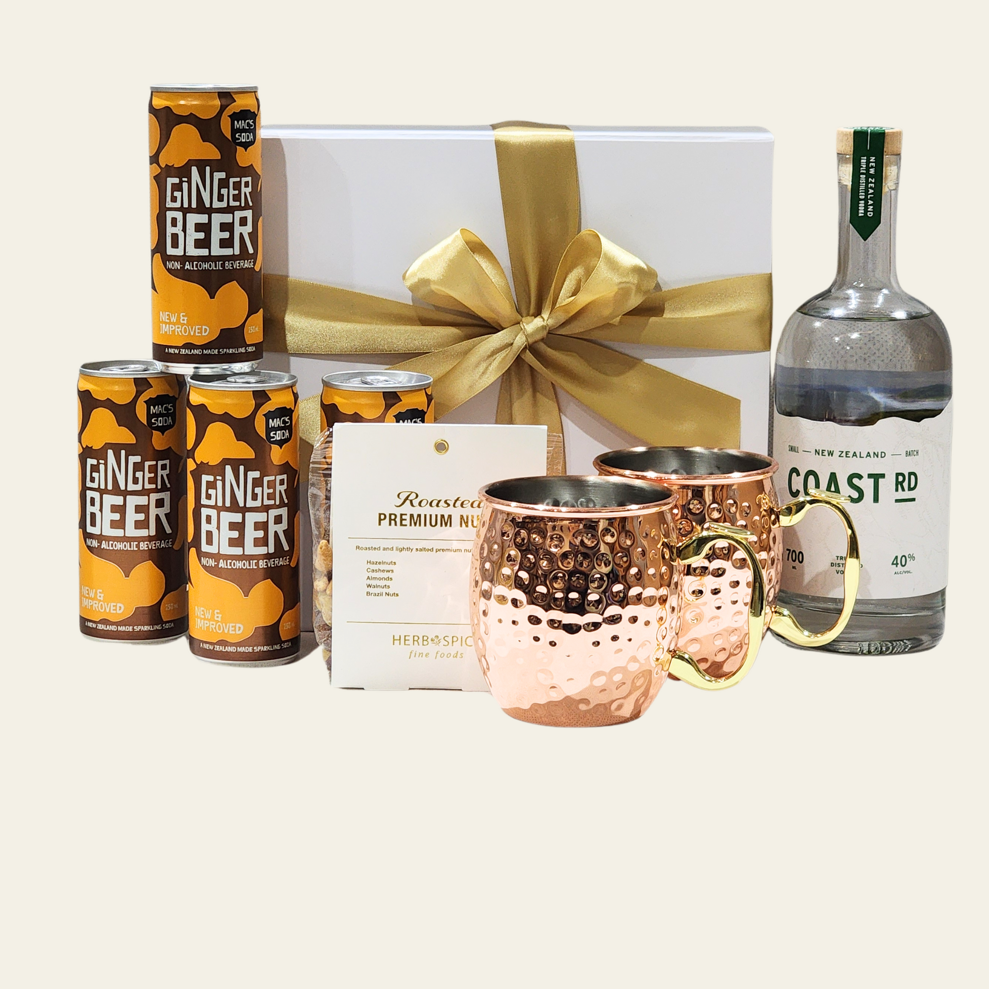 Elegant Moscow Mule gift set with premium Coast Vodka, stainless steel mugs, ginger beer, and a gourmet nut mix.