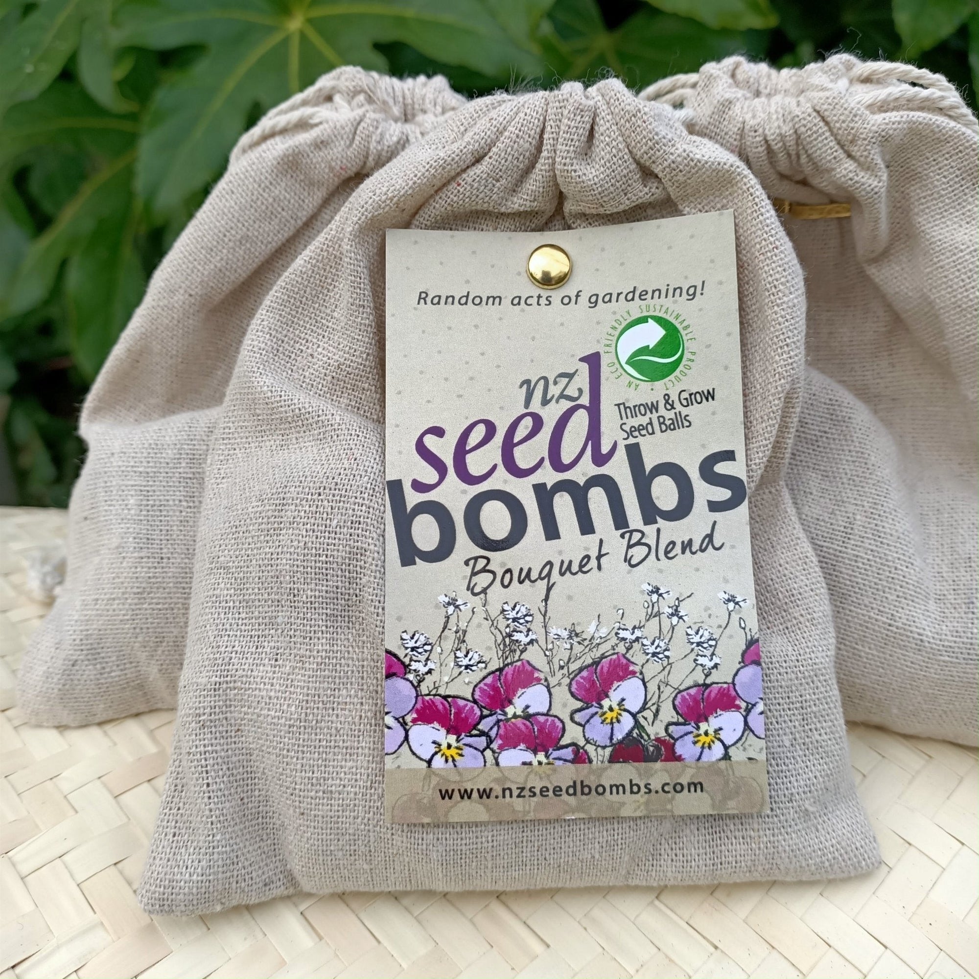 Colorful NZ Seed Bombs - Bouquet Blend in a muslin bag, offering easy gardening with edible violas and baby's breath.