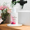 Luxurious pink petal hand and body wash with olive oil, chamomile extract, and a modern floral fragrance for soft, smooth skin.