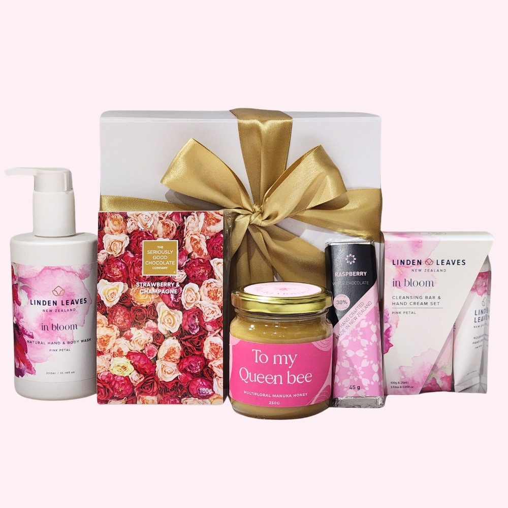 Luxurious "To My Queen Bee" gift box featuring skincare, gourmet chocolates, and premium Manuka honey for special celebrations.