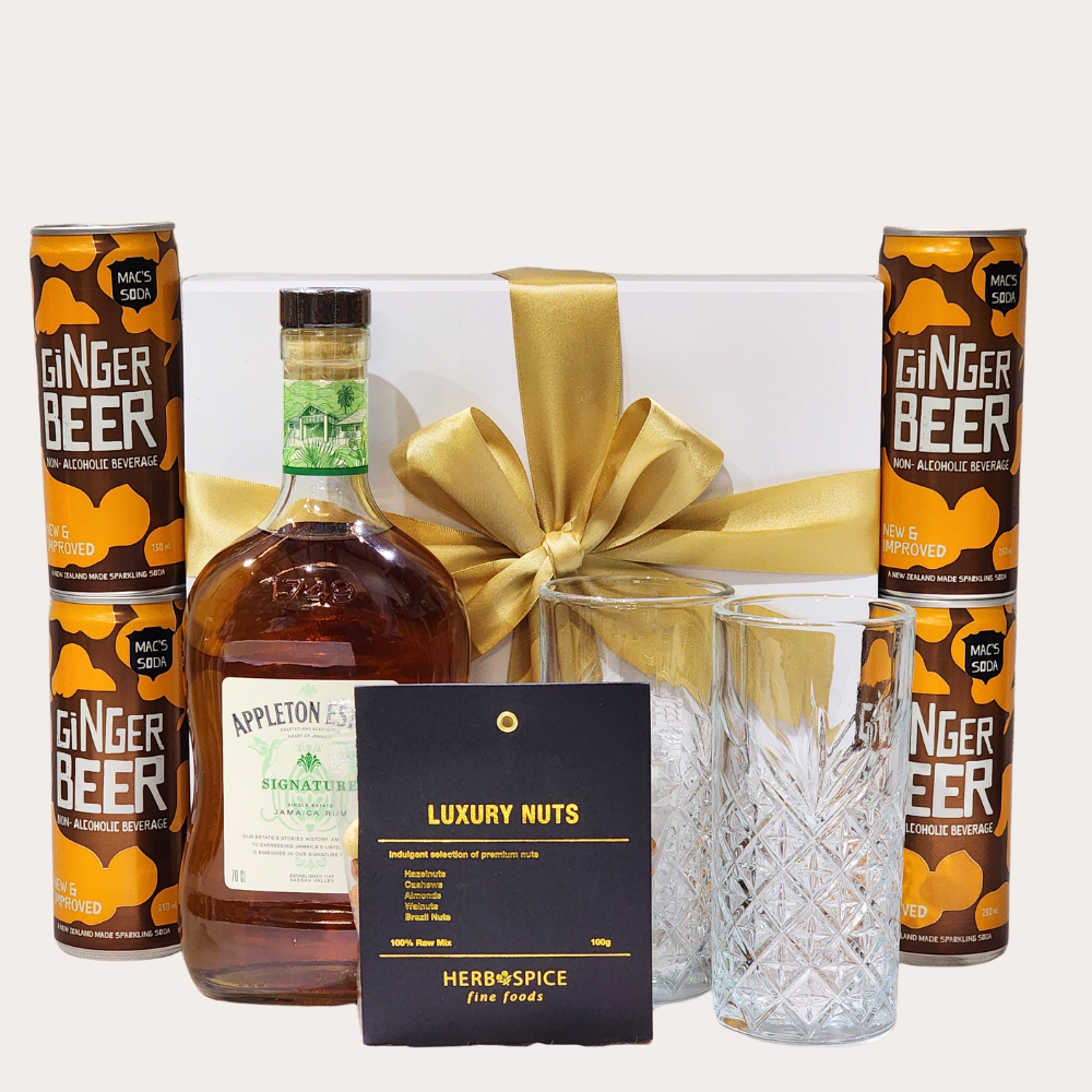 Elegant gift box featuring Appleton rum, gourmet snacks, and ginger beer, ideal for special celebrations.