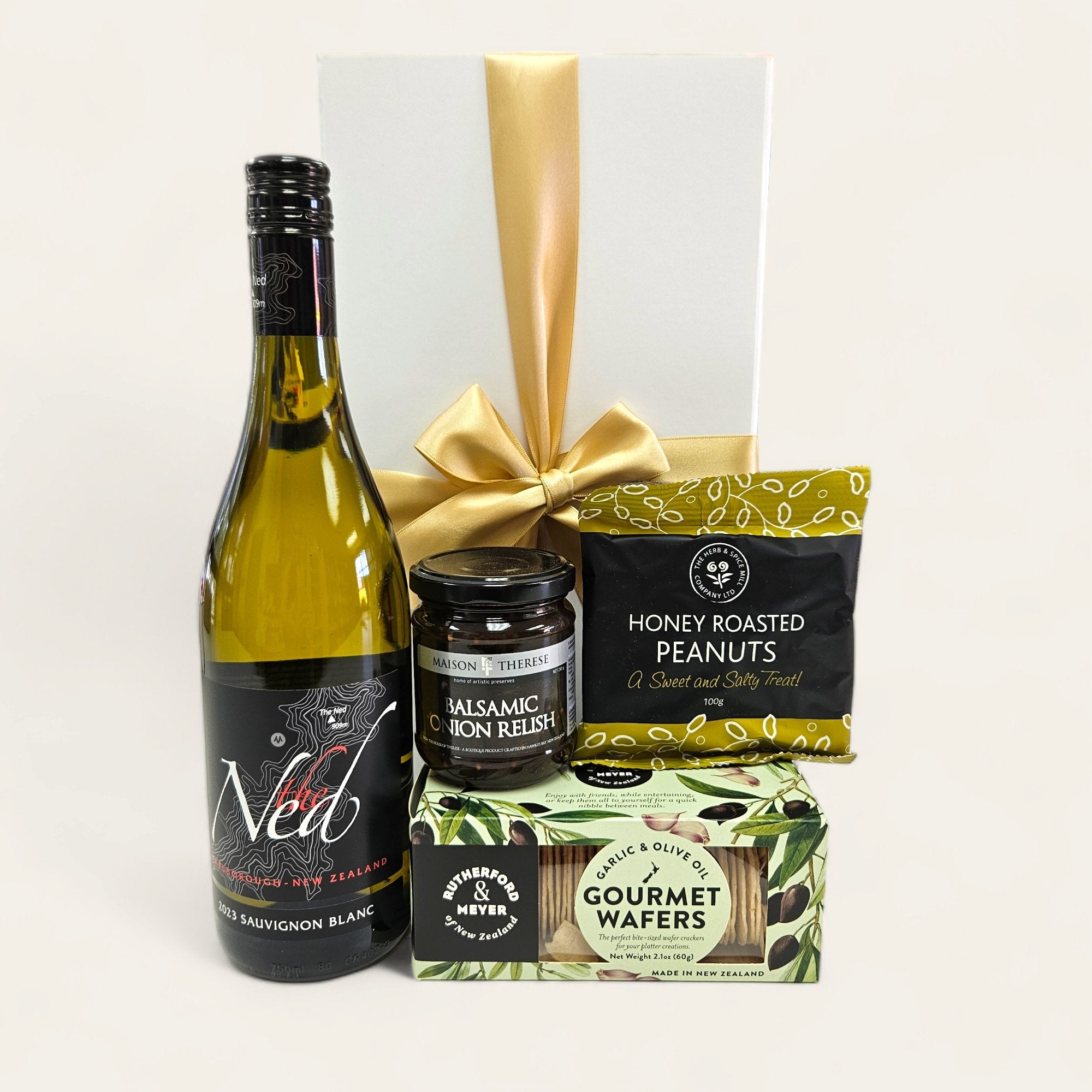 Elegant gift box featuring Ned Sauvignon Blanc and gourmet snacks like honey-roasted peanuts and balsamic onion relish.