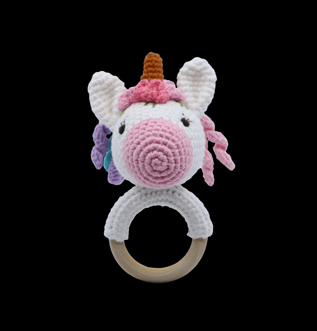 Handmade cotton unicorn rattle with soft filling, machine washable, non-toxic, and comes in a canvas carry bag.