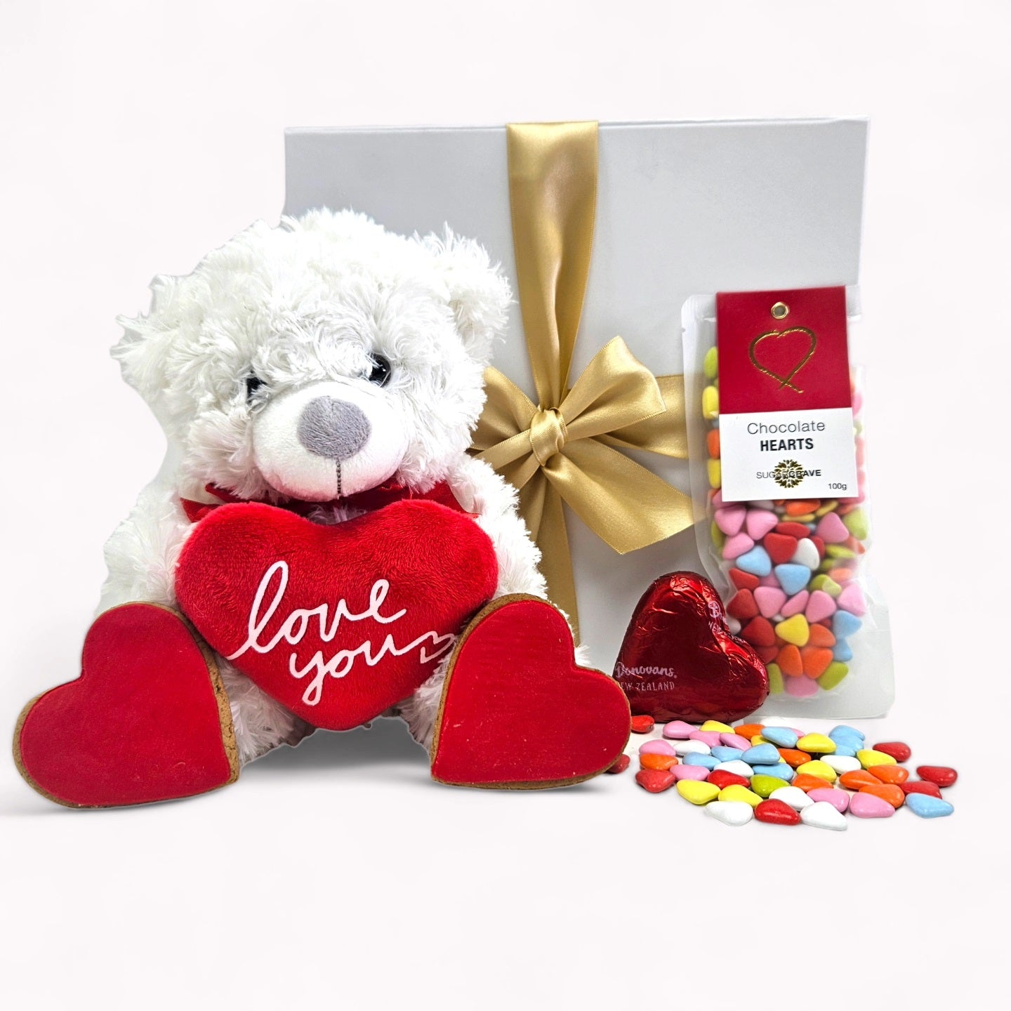 Romantic gift box featuring a bear with a heart, gourmet chocolates, and customizable options to express love.