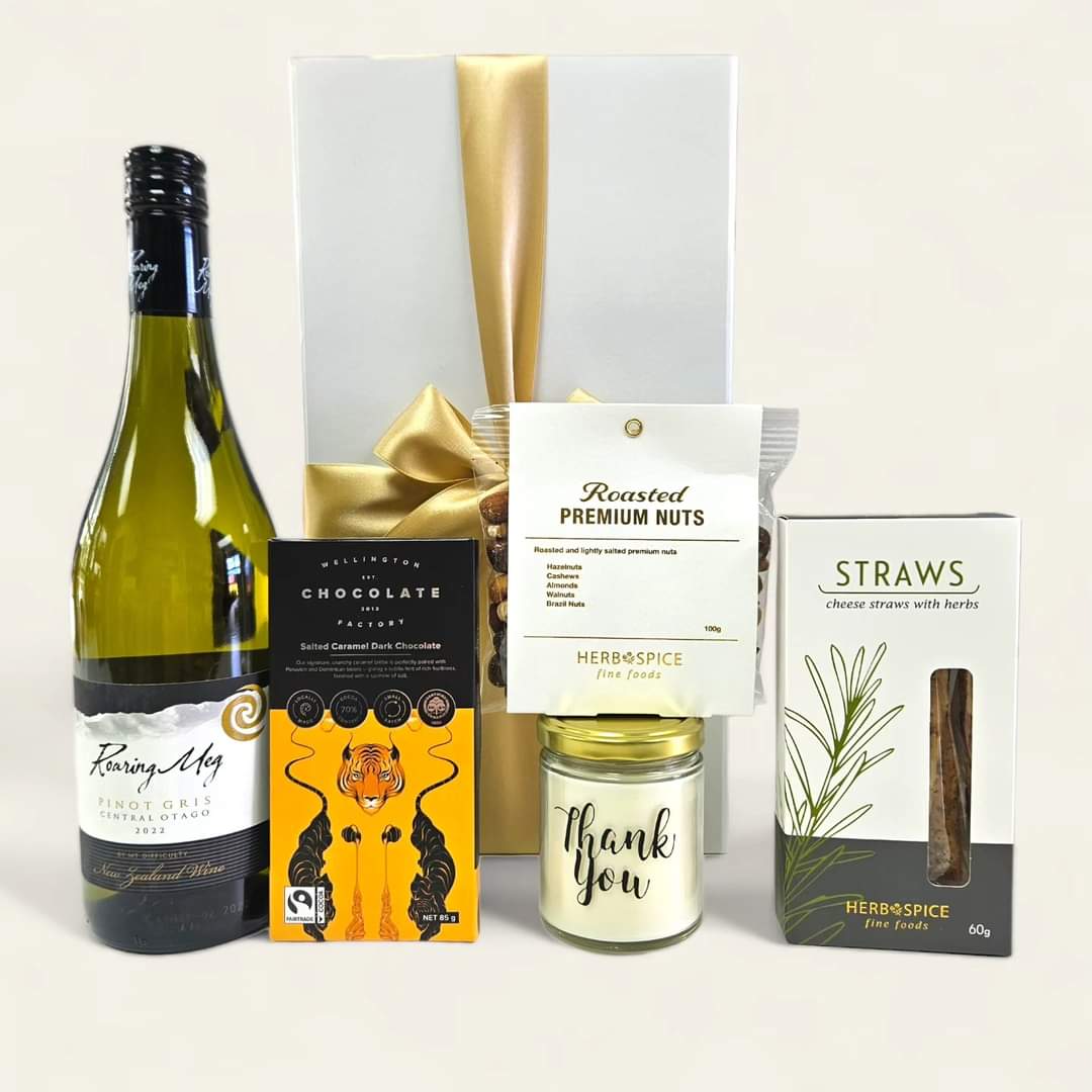 Elegant gift box featuring wine, chocolate, nuts, and a scented candle to express gratitude. Ideal for any occasion.