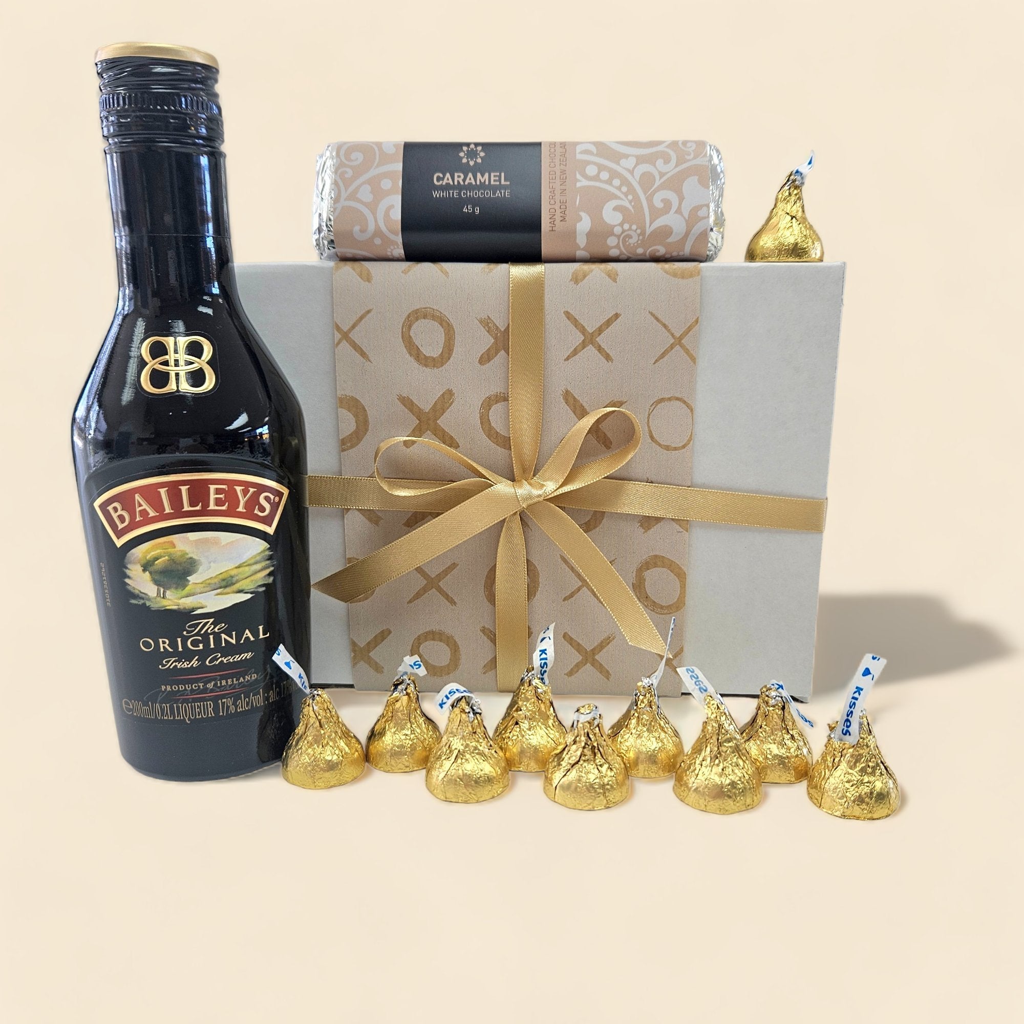 Gift box featuring Baileys Irish Cream, caramel white chocolate bar, and Hershey's Kisses, perfect for expressing sentiments.