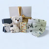 Gorgeous 'Welcome Home Baby' gift box featuring eco-friendly essentials for new parents and their newborn.